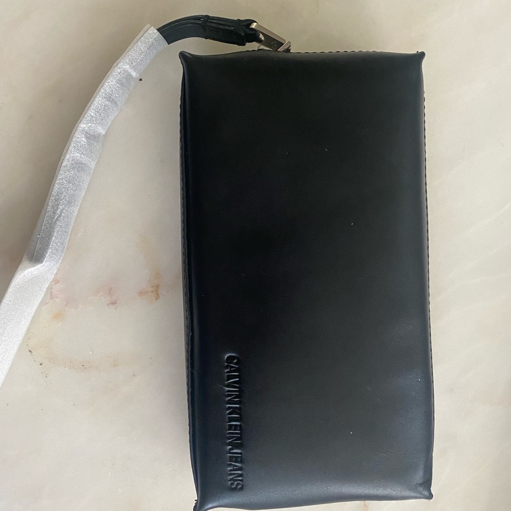 NWT and original casing - Calvin Klein Jeans black wristlet